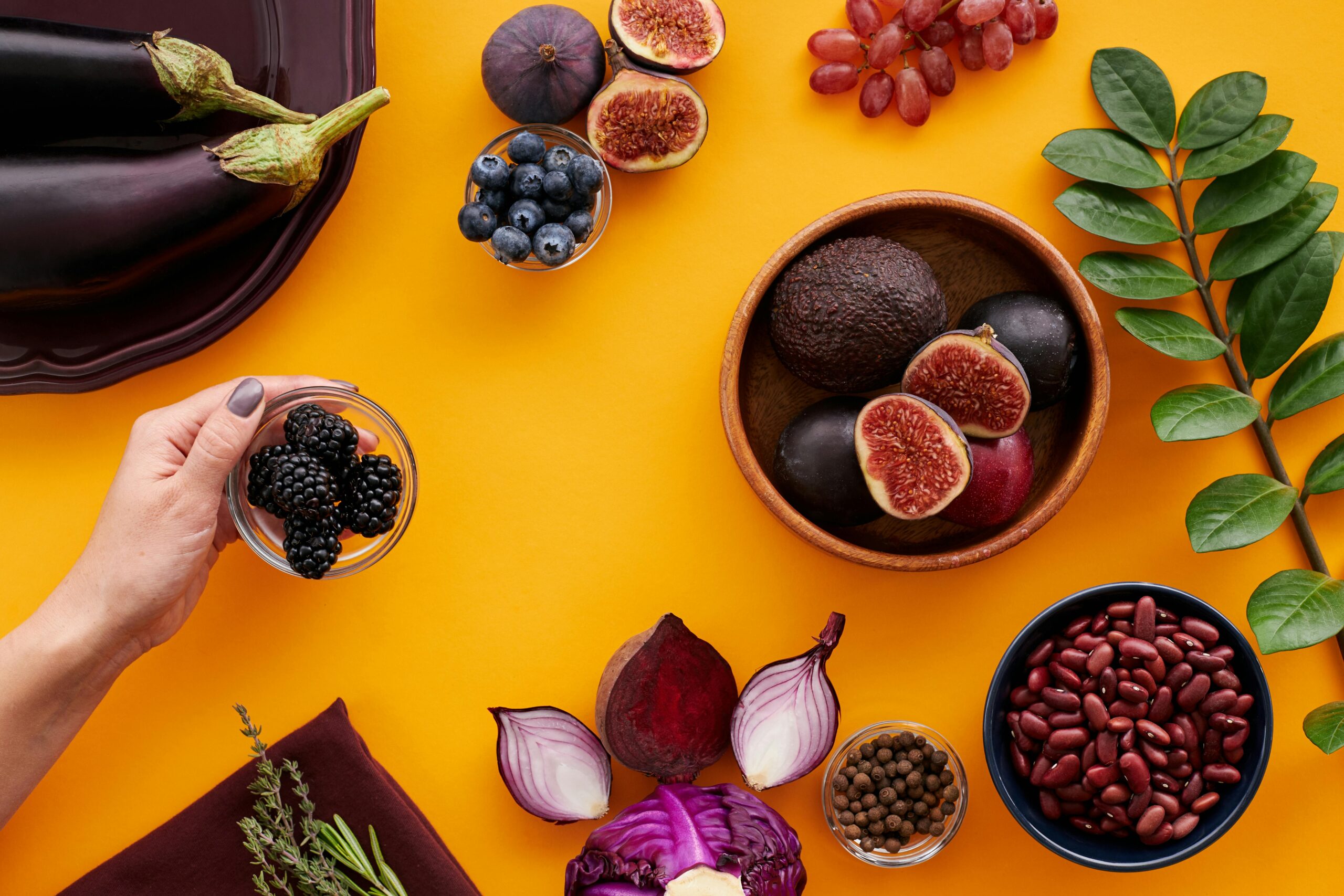 pexels-photo-5965953-5965953 Colorful assortment of fruits and vegetables on a yellow backdrop, highlighting healthy eating.