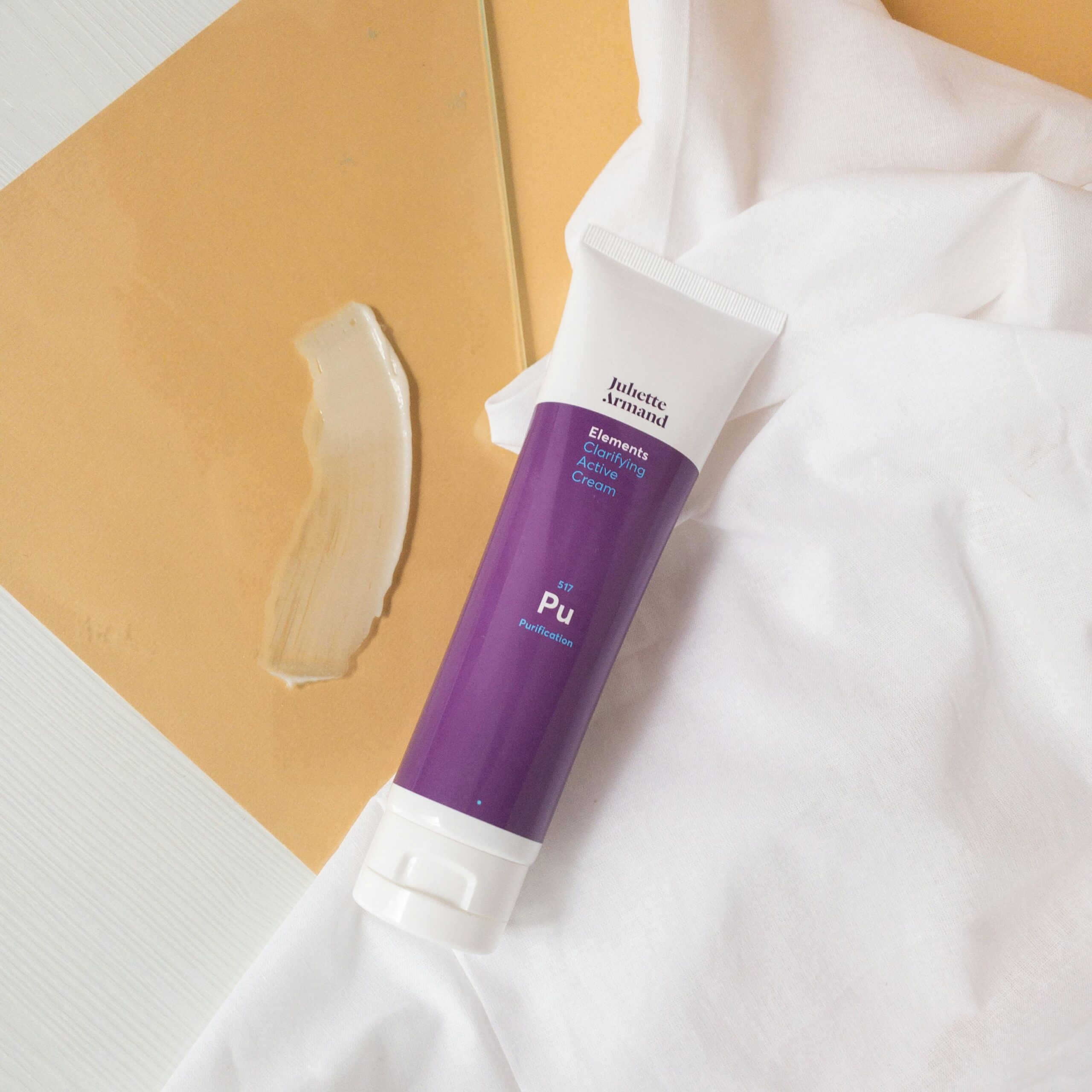 Studio shot of Juliette Armand cleansing cream with minimalistic setup.
