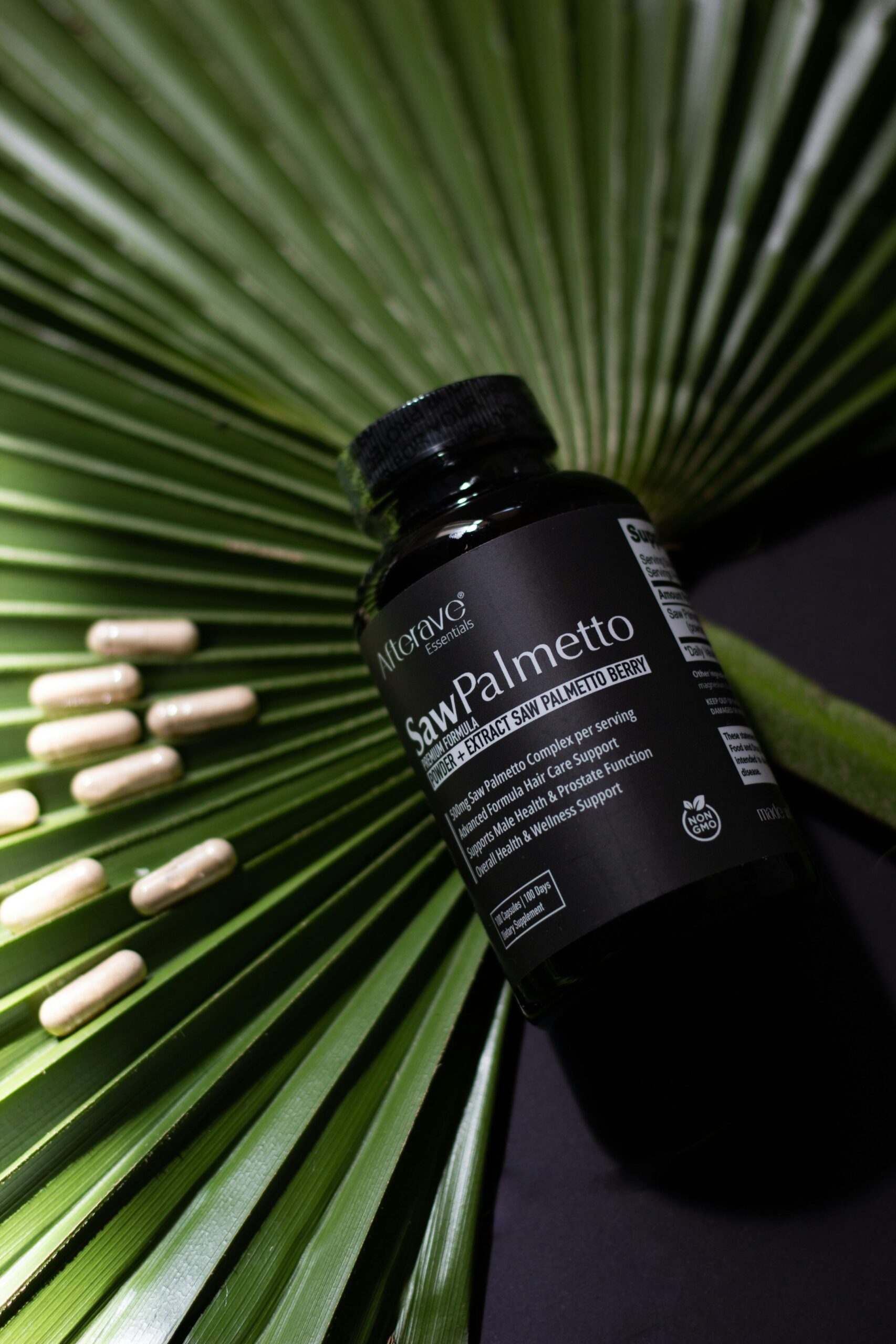 Saw Palmetto bottle with capsules on palm leaf background, perfect for health supplement promotions.