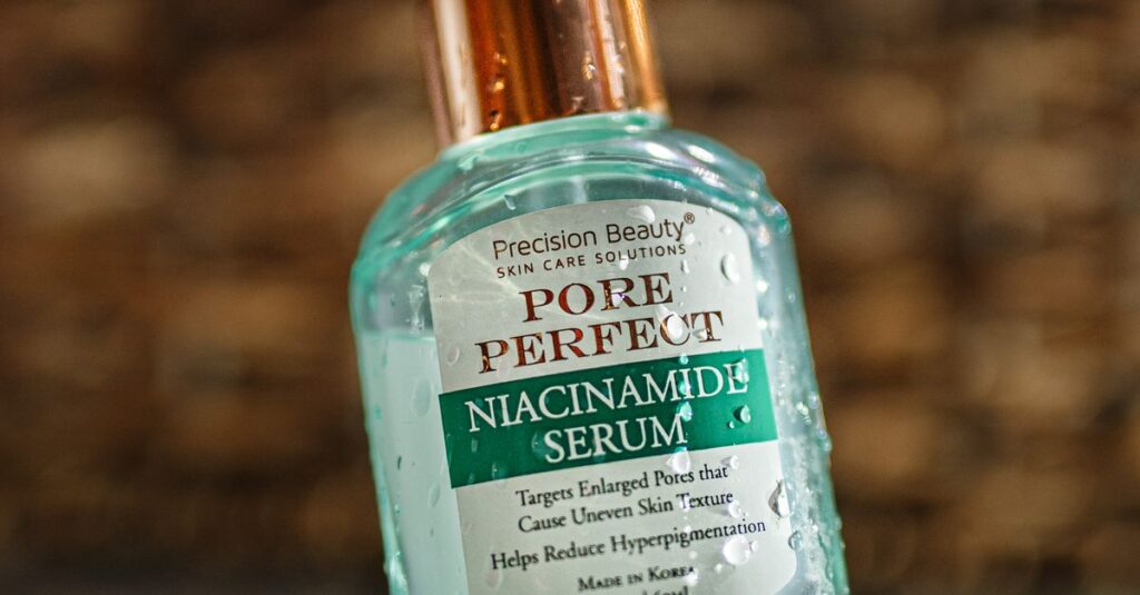 Ingredients Close-up of Pore Perfect Niacinamide Serum bottle with reflective surface enhancing detail and focus.