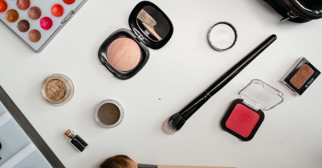 Best Products A flat lay of beauty products including eyeshadow, brushes, and blush on a white surface.