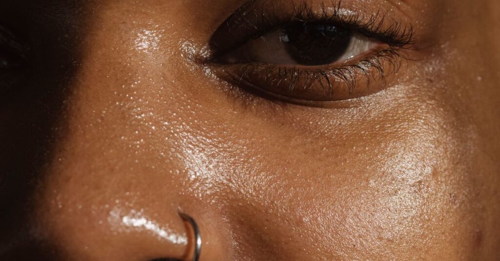 Skincare A detailed close-up of a woman's face highlighting her skin texture and nose ring.